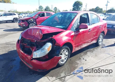 2013 Suzuki Sx4 Le/Le Popular z USA, uszkodzony, nr VIN JS2YC5A36D6100855